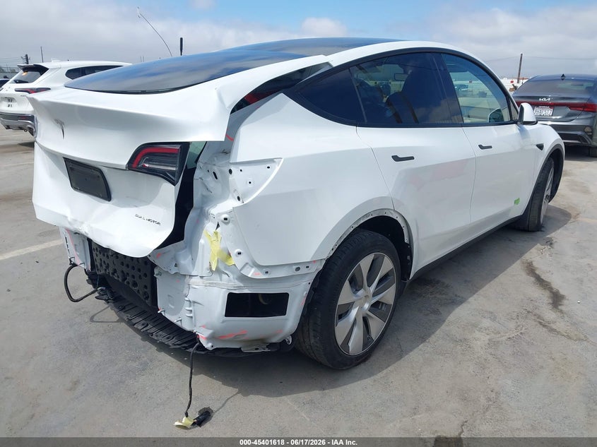 2023 Tesla Model y VIN 7SAYGDEE1PA078602 IAAI salvage auction — REAR END, Salvage (California), sold $11,825 on 2026-07-06 (photo 4)