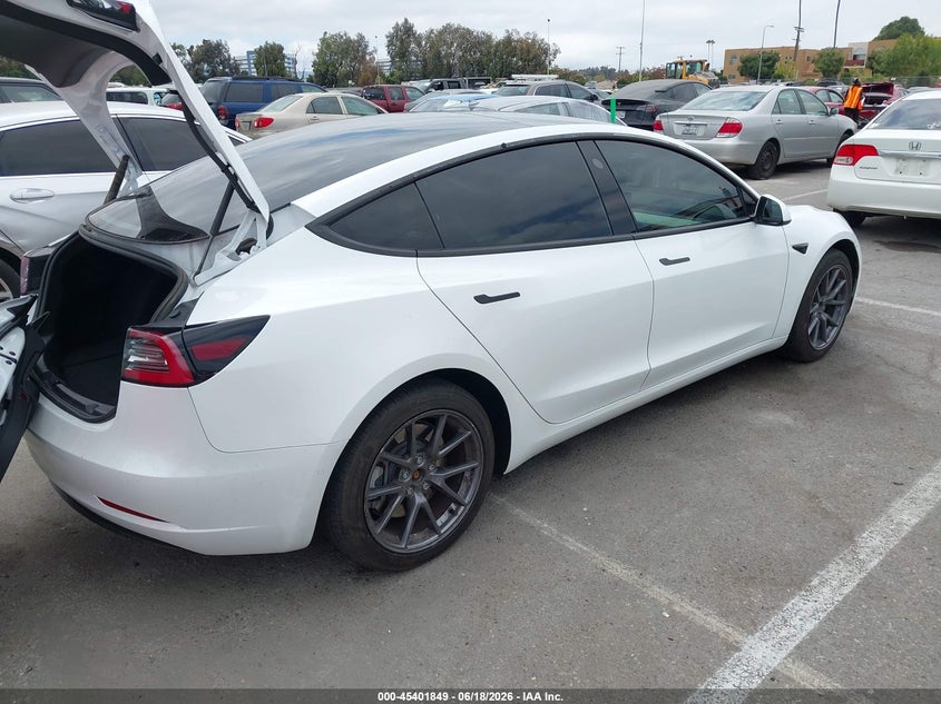 2022 Tesla Model 3 VIN 5YJ3E1EA2NF357954 IAAI salvage auction — SIDE, Salvage (California), sold $9,800 on 2026-07-08 (photo 4)