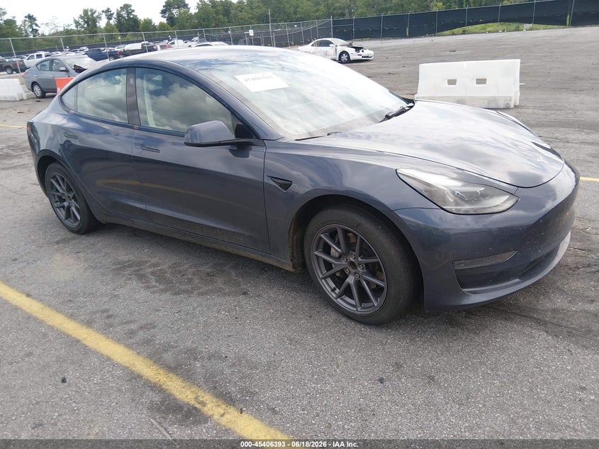 2023 Tesla Model 3 VIN 5YJ3E1EA7PF556145 — IAAI salvage auction photo