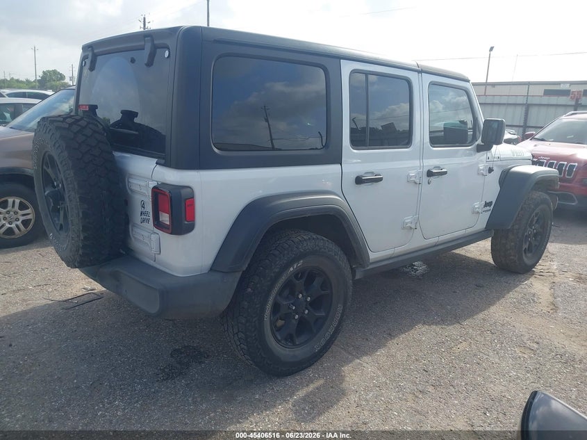 2021 Jeep Wrangler / VIN 1C4HJXDG8MW649984 IAAI salvage auction — REAR END, Salvage Title, sold $9,900 on 2026-08-26 (photo 4)