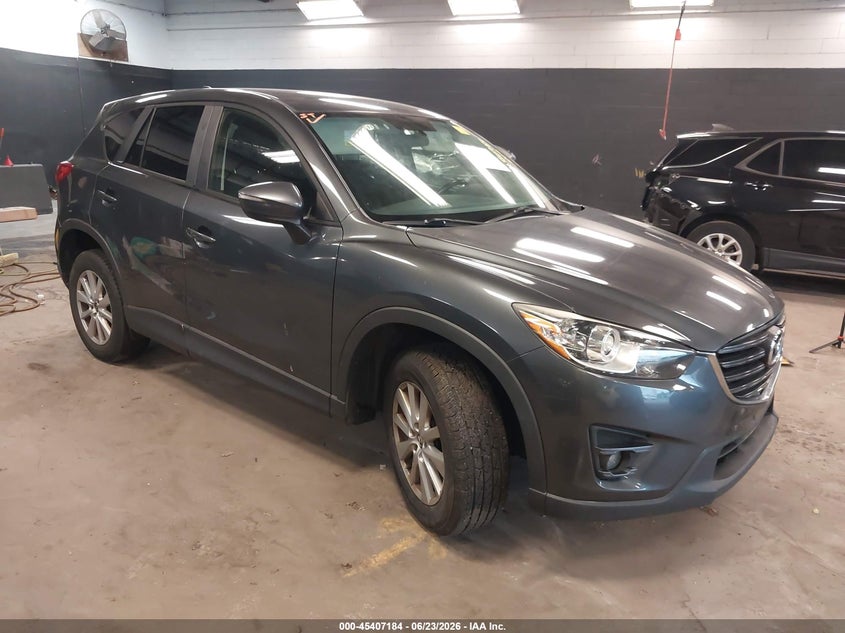 2016 Mazda Cx-5 VIN JM3KE4CY0G0888348 IAAI salvage auction — SIDE, Salvage Title, sold $150 on 2026-07-21 (photo 1)