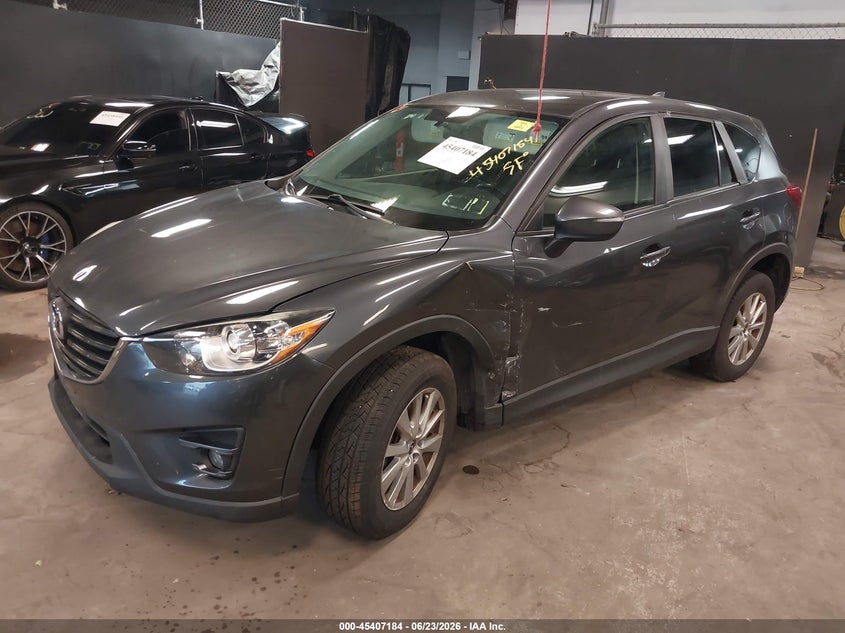 2016 Mazda Cx-5 VIN JM3KE4CY0G0888348 IAAI salvage auction — SIDE, Salvage Title, sold $150 on 2026-07-21 (photo 2)