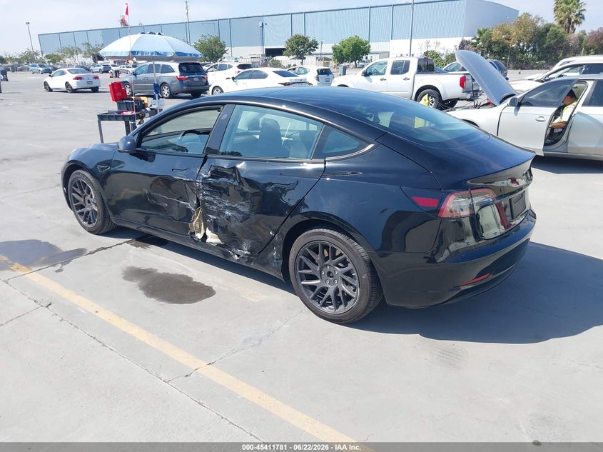 2023 Tesla Model 3 VIN 5YJ3E1EA3PF662916 IAAI salvage auction — SIDE, Wait Title, sold $7,800 on 2026-08-30 (photo 3)