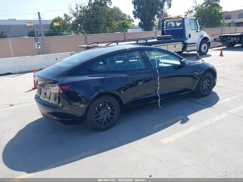 2023 Tesla Model 3 VIN 5YJ3E1EA3PF662916 IAAI salvage auction — SIDE, Wait Title, sold $7,800 on 2026-08-30 (photo 4)