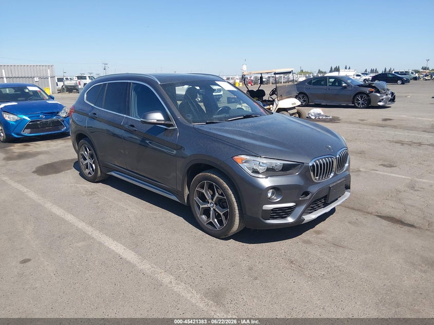 2018 BMW X1 VIN WBXHT3C33J5K31144 IAAI salvage auction — LEFT SIDE, Salvage Title, sold $4,950 on 2026-07-15 (photo 1)