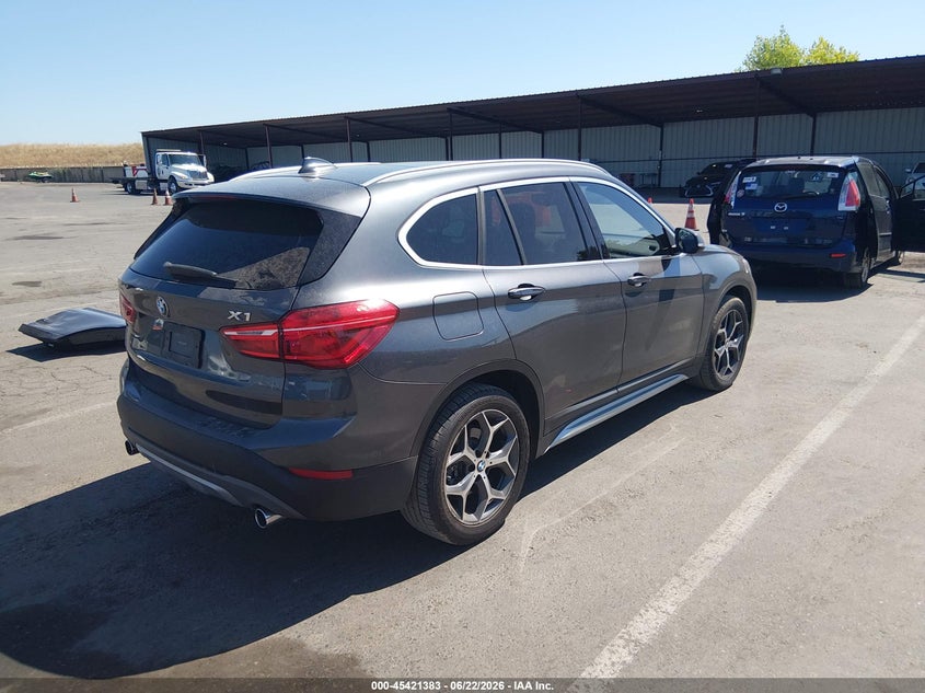 2018 BMW X1 VIN WBXHT3C33J5K31144 IAAI salvage auction — LEFT SIDE, Salvage Title, sold $4,950 on 2026-07-15 (photo 4)
