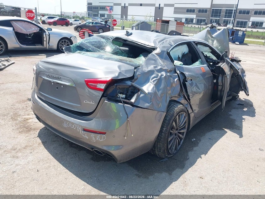 2019 Maserati Ghibli VIN ZAM57YSLXK1329644 IAAI salvage auction — BIO HAZARD, Salvage Title, sold $100 on 2026-09-08 (photo 4)