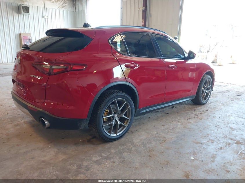 2018 Alfa romeo Stelvio VIN ZASFAKNN1J7C00084 IAAI salvage auction — SIDE, Clear (Michigan), sold $4,550 on 2026-07-09 (photo 4)