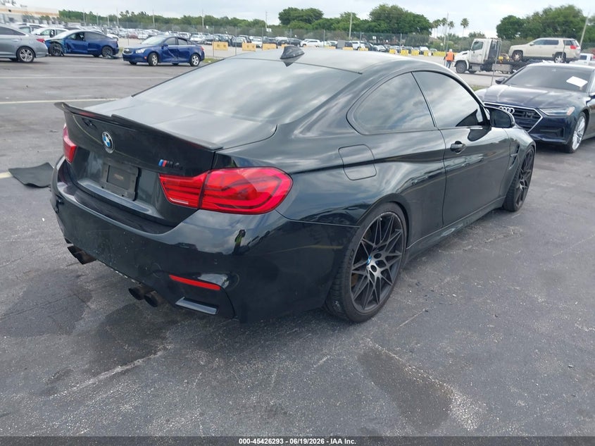 2018 BMW M4 VIN WBS4Y9C5XJAA85376 IAAI salvage auction — WATER/FLOOD, Rebuildable (Florida), sold $15,500 on 2026-07-30 (photo 4)