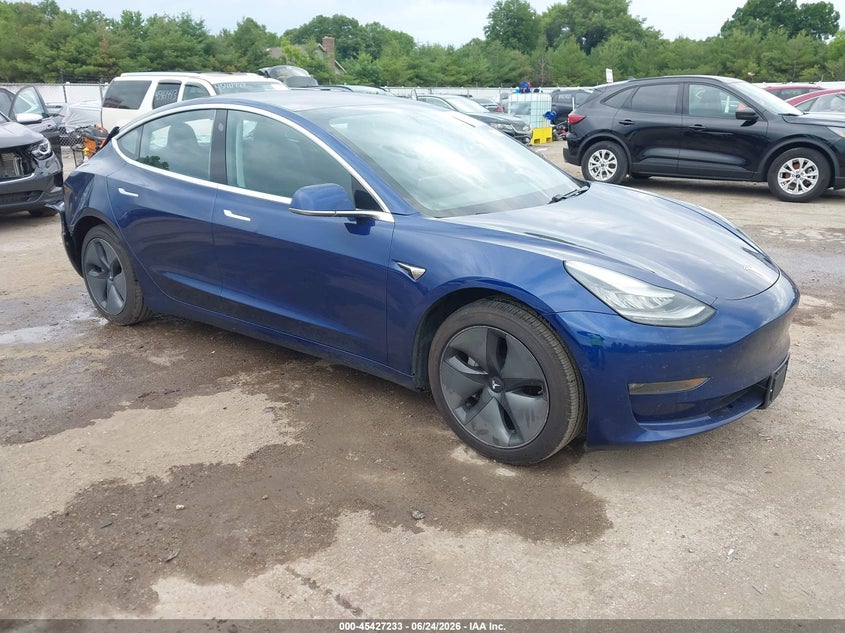 2018 Tesla Model 3 VIN 5YJ3E1EA8JF124994 IAAI salvage auction — STORM DAMAGE, Rebuildable (Florida), sold $3,800 on 2026-07-21 (photo 1)