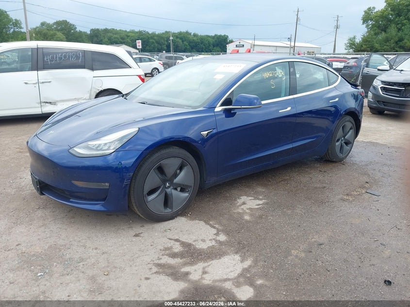 2018 Tesla Model 3 VIN 5YJ3E1EA8JF124994 IAAI salvage auction — STORM DAMAGE, Rebuildable (Florida), sold $3,800 on 2026-07-21 (photo 2)