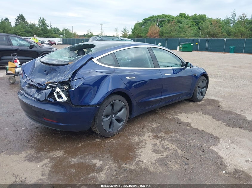2018 Tesla Model 3 VIN 5YJ3E1EA8JF124994 IAAI salvage auction — STORM DAMAGE, Rebuildable (Florida), sold $3,800 on 2026-07-21 (photo 4)