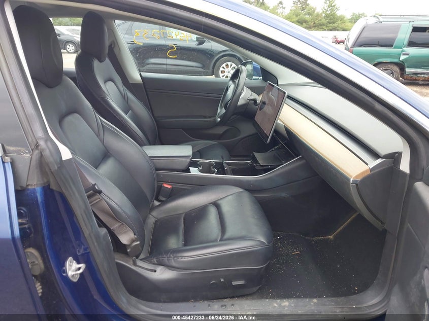 2018 Tesla Model 3 VIN 5YJ3E1EA8JF124994 IAAI salvage auction — STORM DAMAGE, Rebuildable (Florida), sold $3,800 on 2026-07-21 (photo 5)