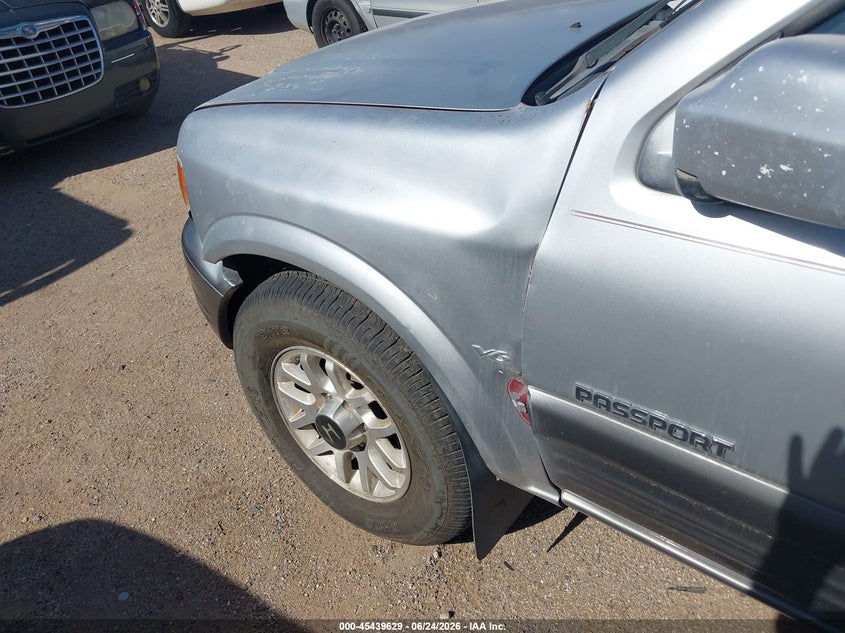 2000 Honda Passport VIN 4S6DM58W4Y4407628 IAAI salvage auction — NORMAL WEAR, Restored (Arizona), sold $250 on 2026-07-09 (photo 6)