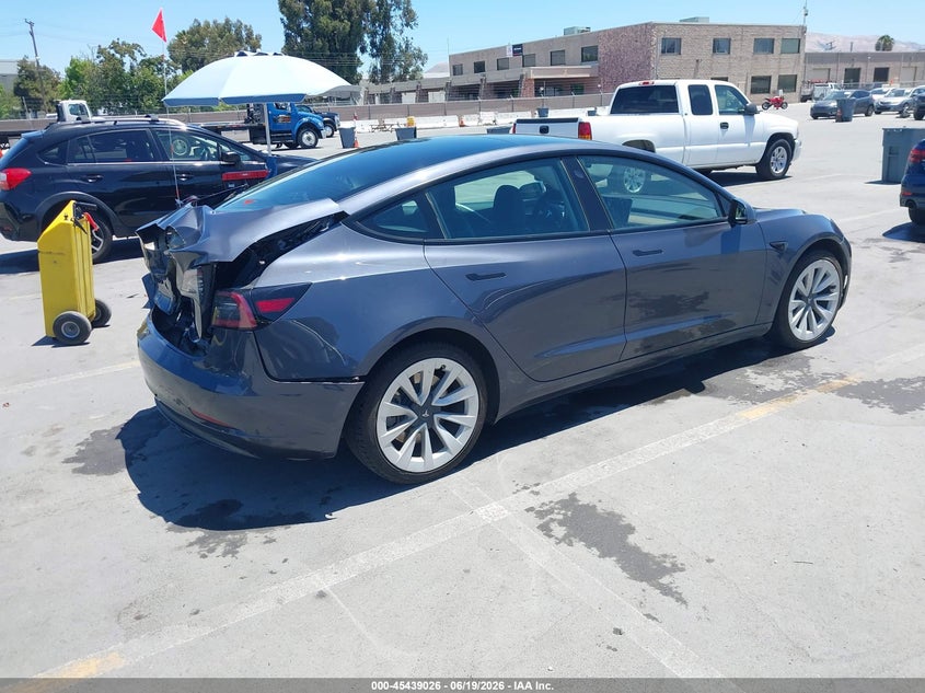 2022 Tesla Model 3 VIN 5YJ3E1EA9NF295145 IAAI salvage auction — REAR END, Salvage Title, sold $5,600 on 2026-07-20 (photo 4)