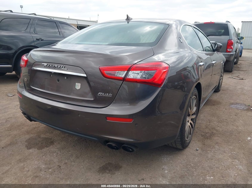 2014 Maserati Ghibli VIN ZAM57RTA5E1101042 IAAI salvage auction — LEFT FRONT, Clear (Oklahoma), sold $5,025 on 2026-08-28 (photo 4)