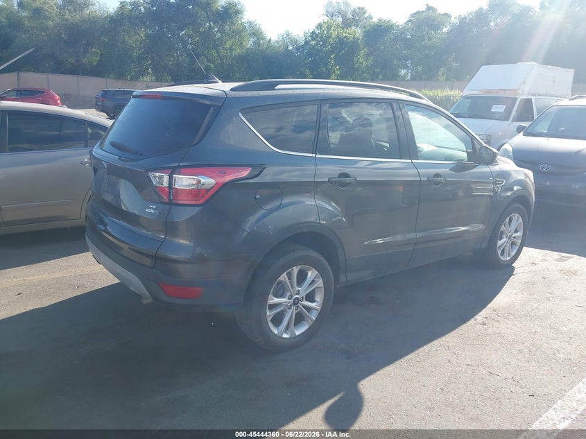2018 Ford Escape VIN 1FMCU9GDXJUB81080 IAAI salvage auction — NORMAL WEAR, Clear (Utah), sold $2,100 on 2026-07-09 (photo 4)