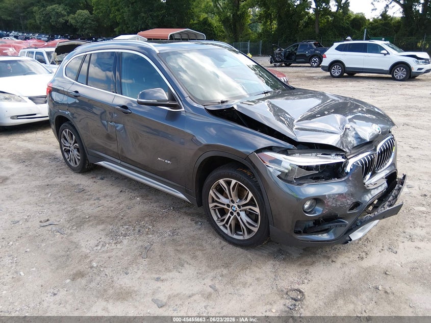 2016 BMW X1 VIN WBXHT3C31GP883323 IAAI salvage auction — FRONT & REAR, Clear (Georgia), sold $1,675 on 2026-07-17 (photo 1)