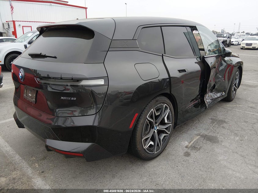 2023 BMW Ix VIN WB523CF02PCL56429 IAAI salvage auction — RIGHT SIDE, Salvage Title, sold $25,500 on 2026-07-23 (photo 4)