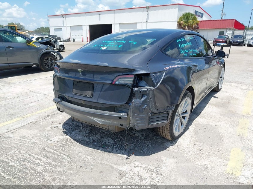 2023 Tesla Model 3 VIN 5YJ3E1EA4PF666165 IAAI salvage auction — REAR END, Rebuildable (Florida), sold $8,600 on 2026-07-16 (photo 6)