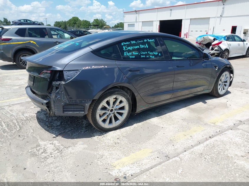 2023 Tesla Model 3 VIN 5YJ3E1EA4PF666165 IAAI salvage auction — REAR END, Rebuildable (Florida), sold $8,600 on 2026-07-16 (photo 4)