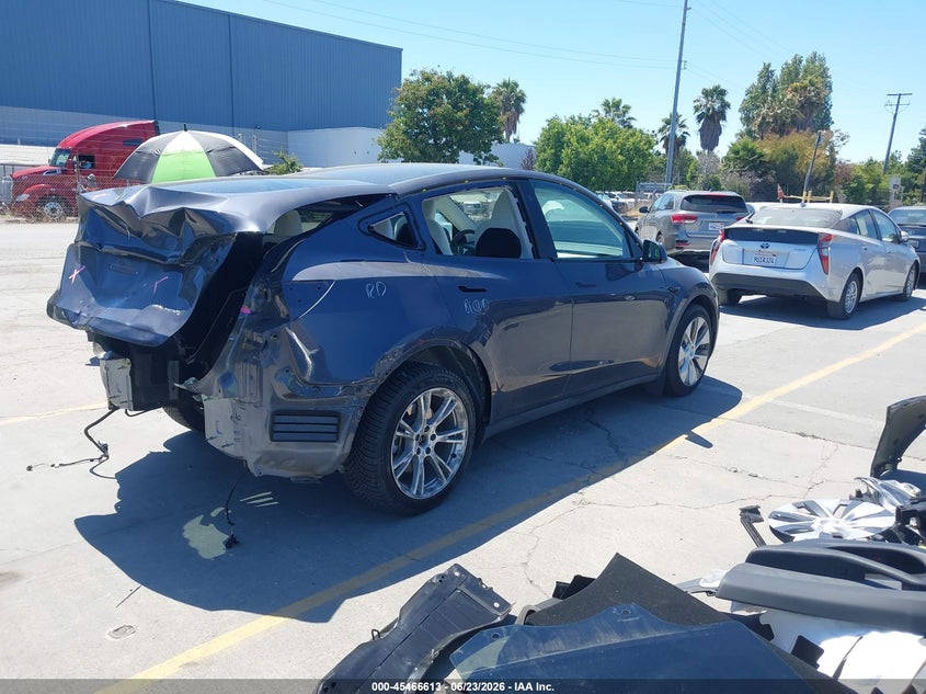 2023 Tesla Model y VIN 7SAYGDEE5PF690093 IAAI salvage auction — REAR END, Salvage (Oregon), sold $12,000 on 2026-08-23 (photo 4)