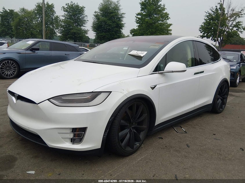 2017 Tesla Model x VIN 5YJXCBE20HF049952 IAAI salvage auction — SIDE, Clear (Montana), sold $4,050 on 2026-07-30 (photo 2)