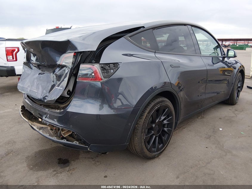2021 Tesla Model y VIN 5YJYGDEEXMF285596 IAAI salvage auction — REAR END, Salvage (Arizona), sold $8,100 on 2026-07-12 (photo 4)