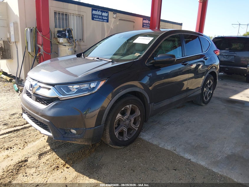 2018 Honda Cr-v VIN 7FARW1H85JE056271 IAAI salvage auction — SIDE, Rebuildable (Florida), sold $4,550 on 2026-07-10 (photo 2)