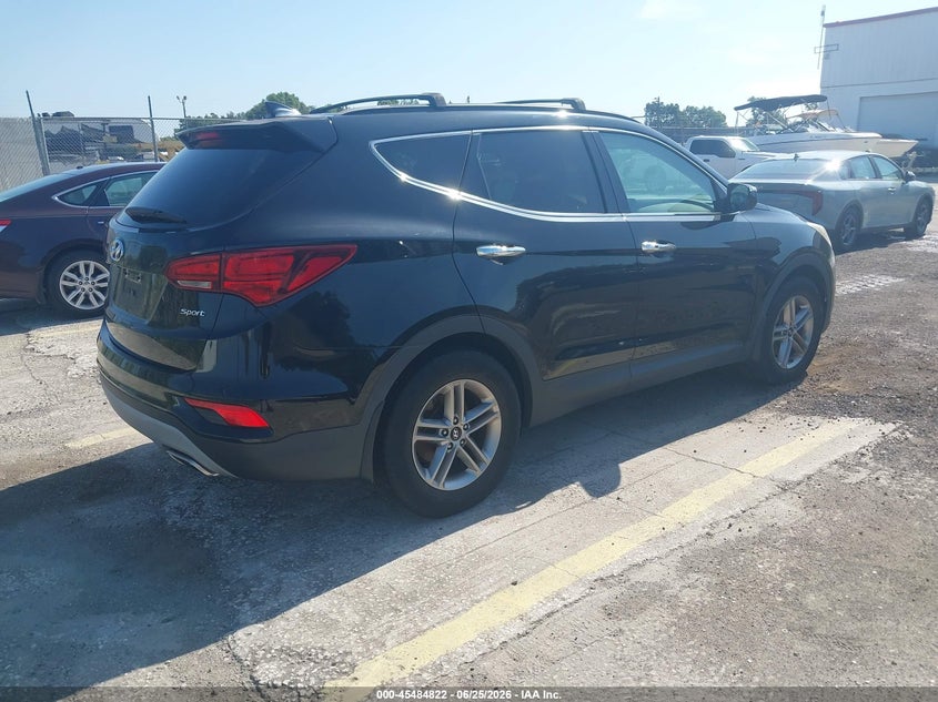 2018 Hyundai Santa fe VIN 5XYZU3LB6JG563110 IAAI salvage auction — NORMAL WEAR, Clear (Florida), sold $4,650 on 2026-07-08 (photo 4)