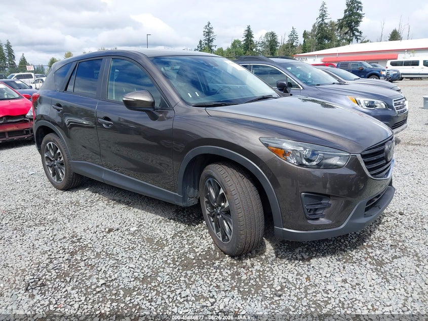2016 Mazda Cx-5 VIN JM3KE4DY3G0674548 IAAI salvage auction — LEFT SIDE, Salvage Title, sold $3,850 on 2026-07-29 (photo 1)