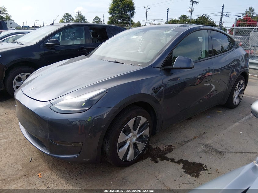 2023 Tesla Model y VIN 7SAYGDEE1PF881154 IAAI salvage auction — STORM DAMAGE, Salvage (Idaho), sold $11,000 on 2026-07-23 (photo 2)