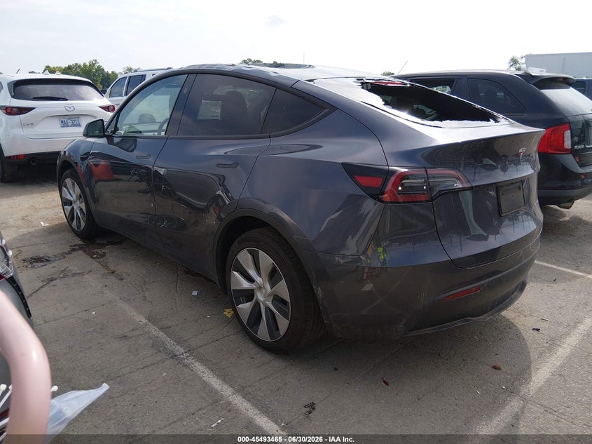 2023 Tesla Model y VIN 7SAYGDEE1PF881154 IAAI salvage auction — STORM DAMAGE, Salvage (Idaho), sold $11,000 on 2026-07-23 (photo 3)