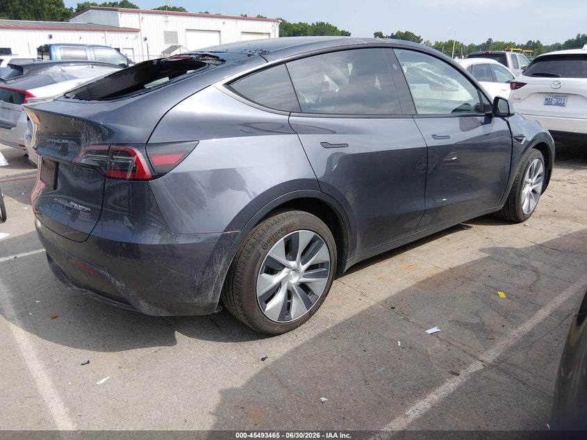 2023 Tesla Model y VIN 7SAYGDEE1PF881154 IAAI salvage auction — STORM DAMAGE, Salvage (Idaho), sold $11,000 on 2026-07-23 (photo 4)