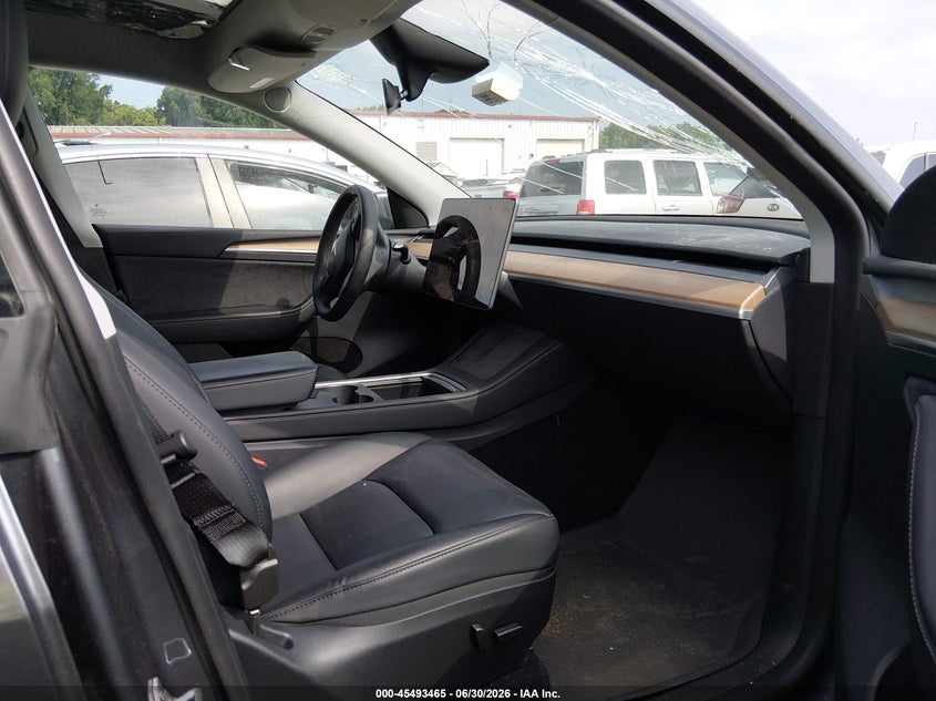 2023 Tesla Model y VIN 7SAYGDEE1PF881154 IAAI salvage auction — STORM DAMAGE, Salvage (Idaho), sold $11,000 on 2026-07-23 (photo 5)
