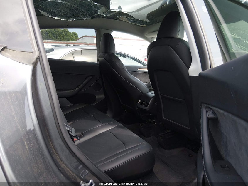 2023 Tesla Model y VIN 7SAYGDEE1PF881154 IAAI salvage auction — STORM DAMAGE, Salvage (Idaho), sold $11,000 on 2026-07-23 (photo 8)