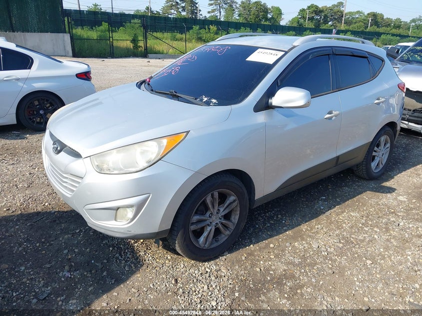 2010 Hyundai Tucson VIN KM8JU3AC9AU044328 IAAI salvage auction — FRONT & REAR, Mv-907A (New York), sold $1,900 on 2026-07-14 (photo 2)