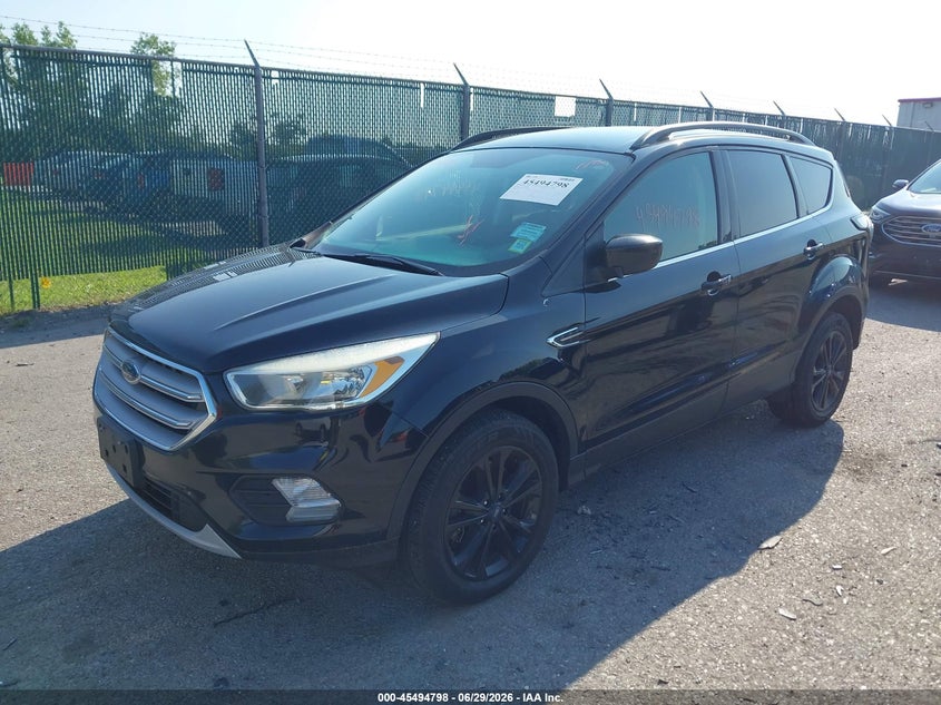 2018 Ford Escape VIN 1FMCU9GD3JUA00143 IAAI salvage auction — NORMAL WEAR, Clear (New York), sold $475 on 2026-07-21 (photo 2)