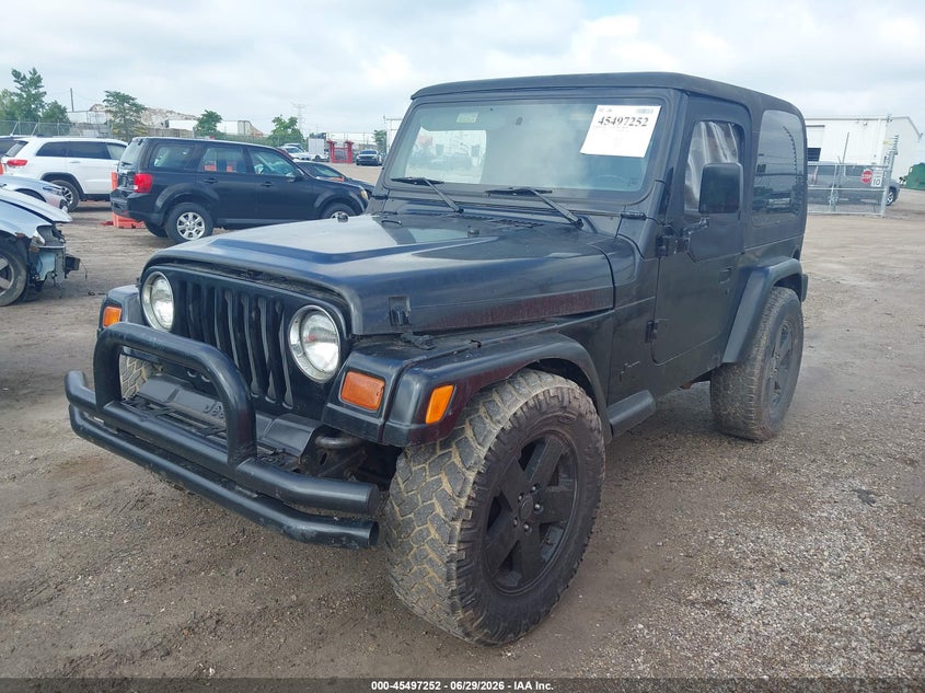 1997 Jeep Wrangler / VIN 1J4FY29P3VP517400 IAAI salvage auction — NORMAL WEAR, Clear (Wisconsin), sold $1,200 on 2026-07-08 (photo 2)