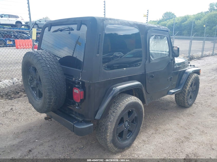 1997 Jeep Wrangler / VIN 1J4FY29P3VP517400 IAAI salvage auction — NORMAL WEAR, Clear (Wisconsin), sold $1,200 on 2026-07-08 (photo 4)