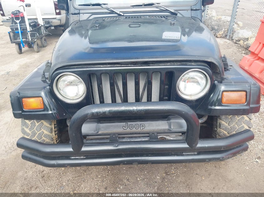 1997 Jeep Wrangler / VIN 1J4FY29P3VP517400 IAAI salvage auction — NORMAL WEAR, Clear (Wisconsin), sold $1,200 on 2026-07-08 (photo 6)