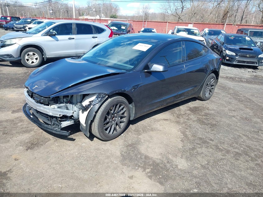 2025 Tesla Model 3 VIN 5YJ3E1EA1SF953388 IAAI salvage auction — FRONT & REAR, Salvage (Idaho), sold $9,200 on 2026-07-08 (photo 2)