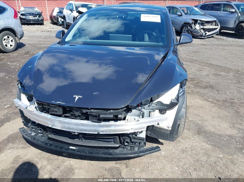 2025 Tesla Model 3 VIN 5YJ3E1EA1SF953388 IAAI salvage auction — FRONT & REAR, Salvage (Idaho), sold $9,200 on 2026-07-08 (photo 6)