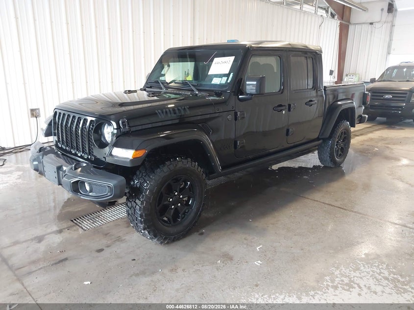 2023 Jeep Gladiator VIN 1C6HJTAG1PL525419 IAAI salvage auction — REPOSSESSION, Salvage Title, sold $21,000 on 2026-09-08 (photo 2)