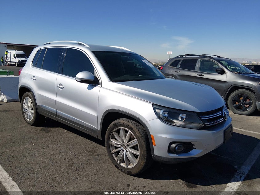 2014 Volkswagen Tiguan VIN WVGAV3AXXEW599640 IAAI salvage auction — LEFT FRONT, Wait Title, sold $1,150 on 2026-08-14 (photo 1)