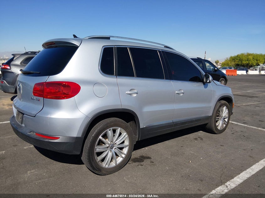 2014 Volkswagen Tiguan VIN WVGAV3AXXEW599640 IAAI salvage auction — LEFT FRONT, Wait Title, sold $1,150 on 2026-08-14 (photo 4)