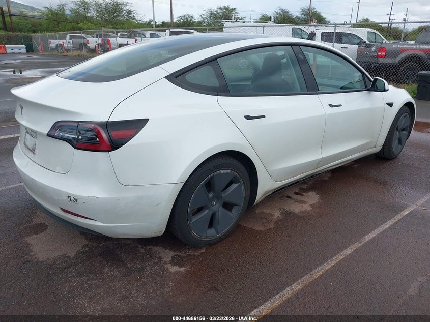 2023 Tesla Model 3 VIN 5YJ3E1EA4PF407661 IAAI salvage auction — SIDE, Salvage (Hawaii), sold $4,450 on 2026-07-28 (photo 4)