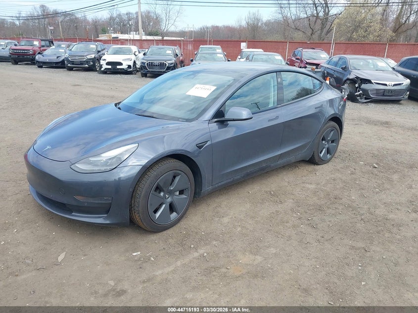 2022 Tesla Model 3 VIN 5YJ3E1EAXNF111993 IAAI salvage auction — SIDE, Salvage (Idaho), sold $7,100 on 2026-07-15 (photo 2)