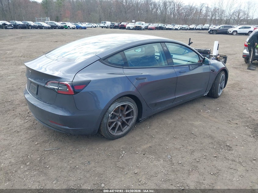 2022 Tesla Model 3 VIN 5YJ3E1EAXNF111993 IAAI salvage auction — SIDE, Salvage (Idaho), sold $7,100 on 2026-07-15 (photo 4)