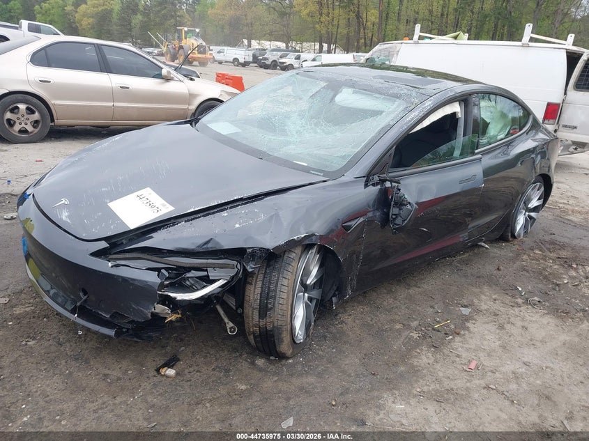 2025 Tesla Model 3 VIN 5YJ3E1EB5SF897979 IAAI salvage auction — ROLLOVER, Wait Title, sold $7,975 on 2026-07-08 (photo 2)